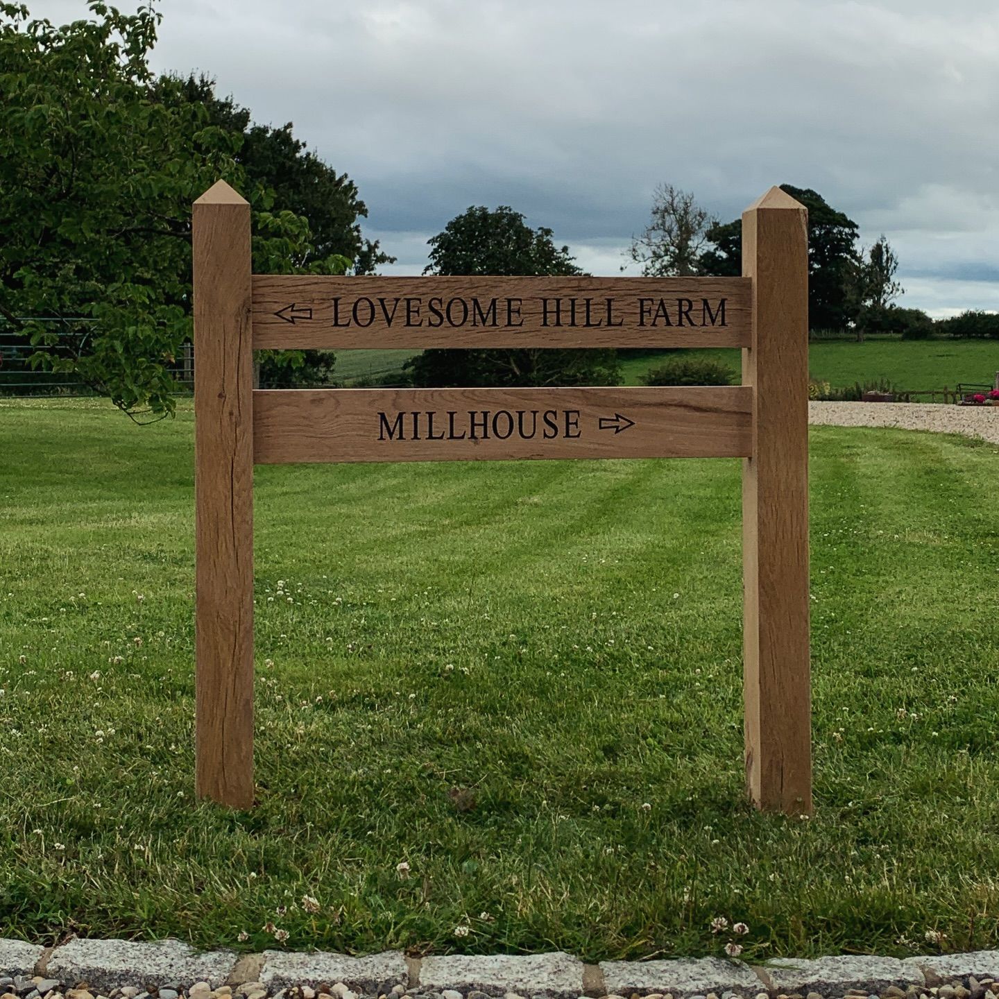 Solid oak engraved direction sign on oak posts
